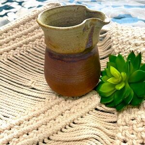 Art pottery creamer. Signed Earth Tones